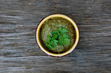raw vegan mushroom pasty with parsley on wooden table