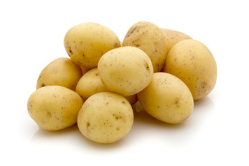 Potatoes on the white background.  New harvest.