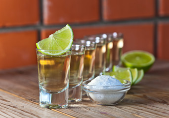 gold tequila with salt and lime