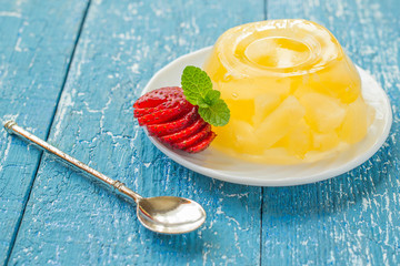 Delicious jelly pineapple, strawberry and dessert spoon