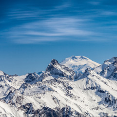 Snowy peaks against the blue sky