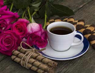 coffee, flowers pink and cookies of two types