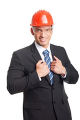 Businessman in suit and with a protective helmet