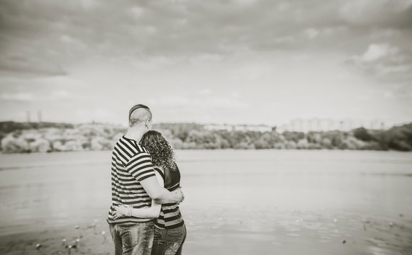 Pretty couple outdoor with lake on background