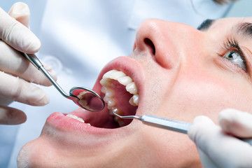 Young man having dental checkup.