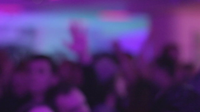 Nightclub culture, party atmosphere, shadows of people dancing