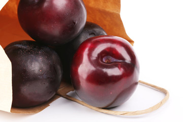 plum isolated on white background paper shopping bags