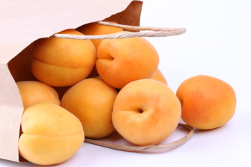 Apricot in a paper shopping bags