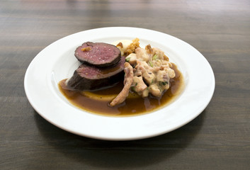 Grilled saddle of deer, grilled octopus, dressing 