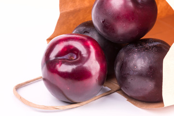 plum isolated on white background paper shopping bags