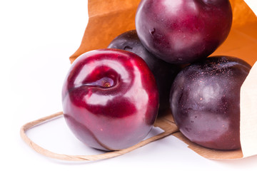 plum isolated on white background paper shopping bags