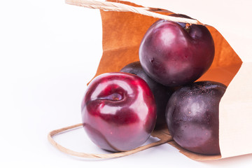 plum isolated on white background paper shopping bags