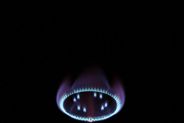 Burning gas burner flame in the dark mystic romance