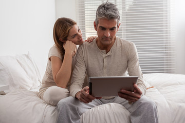 Couple having fun with the ipad