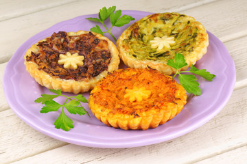 Three mini vegetarian quiches