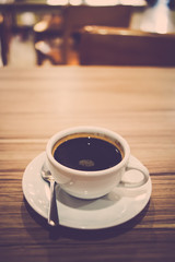 Hot coffee on table. Retro filter