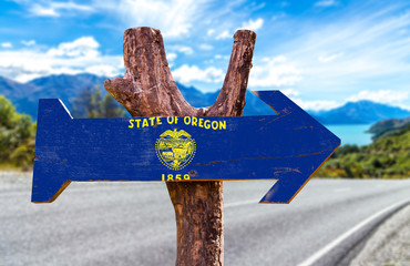Oregon Flag wooden sign with street background