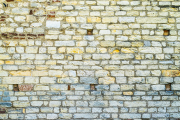 colored wall made of stone and brick