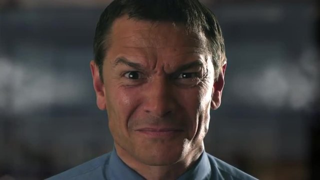 Angry businessman with steam coming out of ears. 