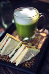 Matcha green tea latte on wooden table