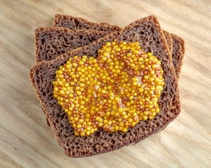 Rye bread slices with mustard