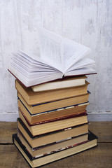 vintage books on  wooden background, education concept