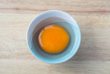 Healthy egg in ceramic bowl