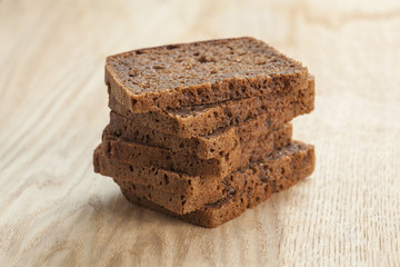 Rye bread slices on table