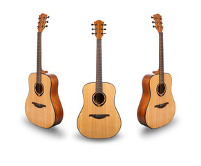 Three acoustic guitars on white