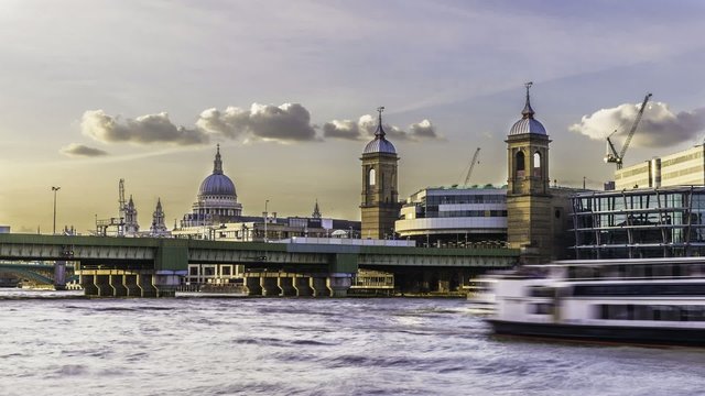 Timelapse of City of London skyline  near Cannon street with St Paul cathedral at sunset