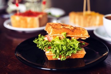 Ham and cheese sandwich served with hot coffee