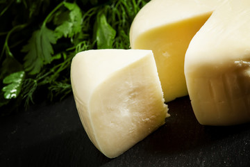 Traditional Caucasian homemade cheese sulguni, selective focus