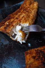A piece of fish fillett fried in batter