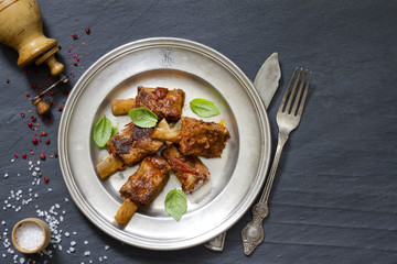 Pork ribs on old plate food abstract concept