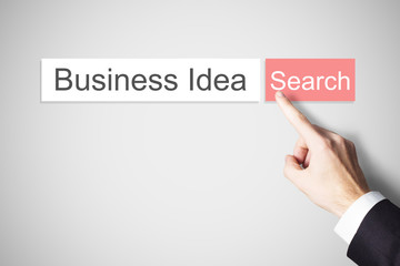 finger pushing red web search button business idea