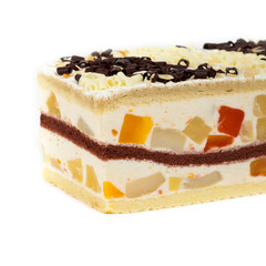 Fruit yogurt cheesecake on white background. Selective focus.