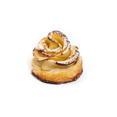 Pastry with apple shaped roses on white background. Macro. Selective focus.