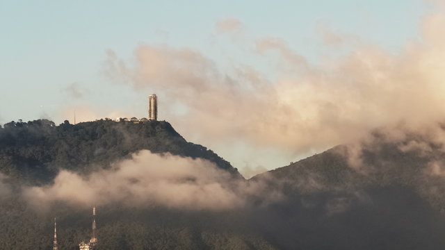 Time lapse of clouds moving over a building on top of mountain. 4K-2160. Humboldt hotel on top of the Avila mountain, Caracas, Venezuela,