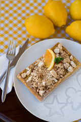 Waffles with meringue, lemon curls and orange slices 