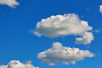 Bright blue sky with cumulus clouds