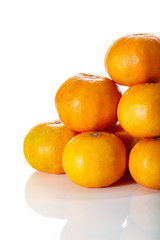 Stack of tropical tangerines, isolated on white with clipping pa
