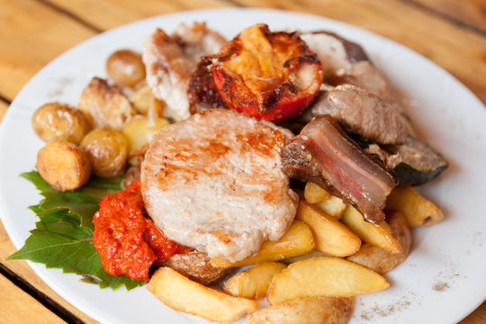 Plate with grilled meat and chicken in local Croatian restaurant