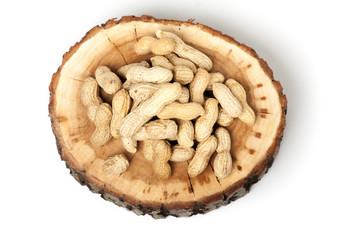 Pile of unshelled peanuts, isolated on white background