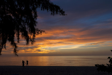 Fototapeta premium Thailand,Koh Phangan Island Sunset men walking