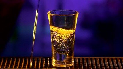 Bartender is making, pouring cocktail, shots, slow motion