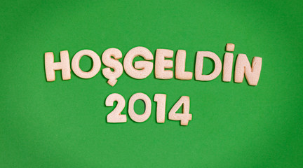 Obraz premium New year cookies text: Welcome 2014