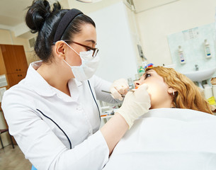 female asian dentist doctor at work