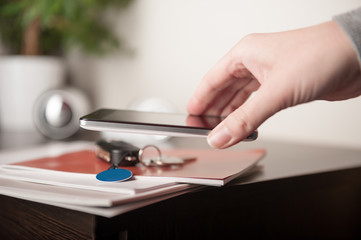Fototapeta premium Smartphone and NFC tag, NFC (Near Field Communication) theme