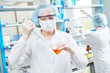 laboratory worker with flask 