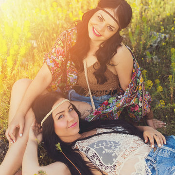 Two hippie boho girls in summer outdoors